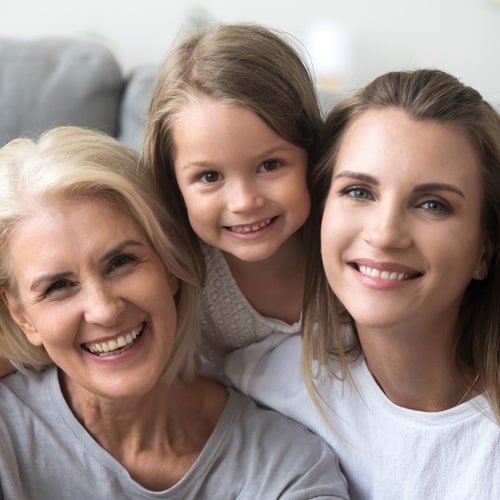 granddaughter mother and grandmother sitting together