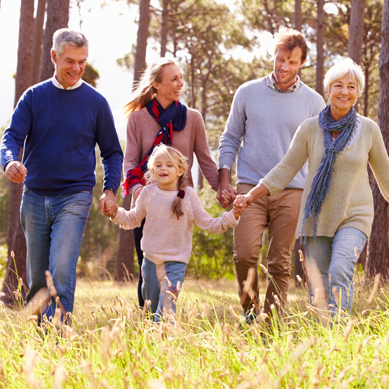 Happy multi-generation family walking