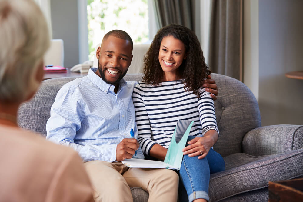 Happy young couple taking advice