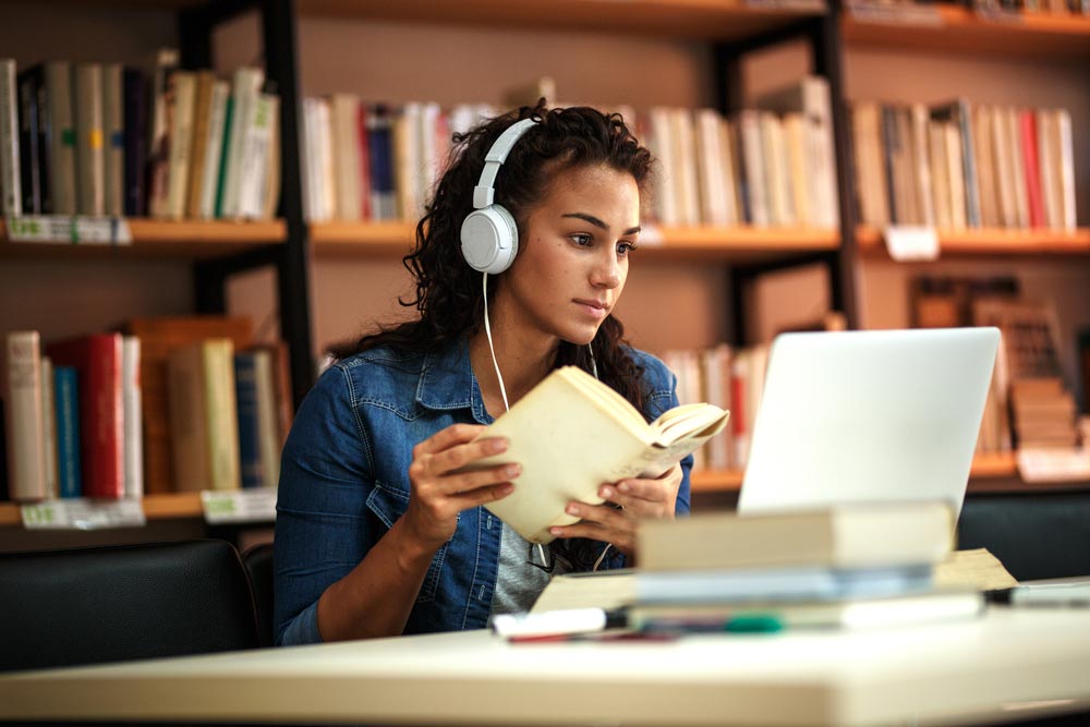 Young female student study in the school library