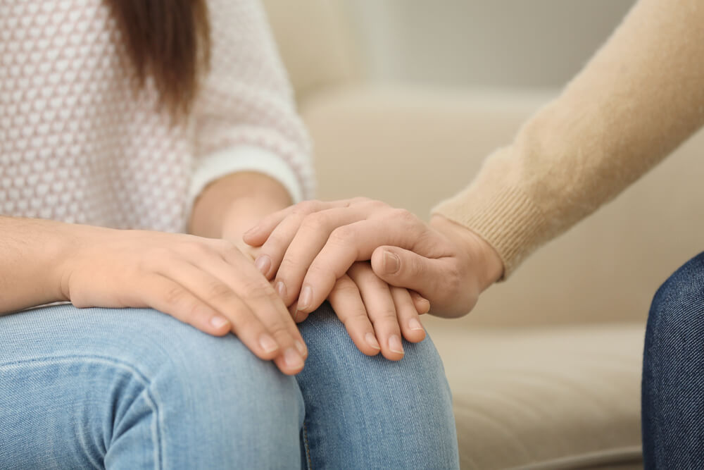 Young depressed woman at psychologist's office