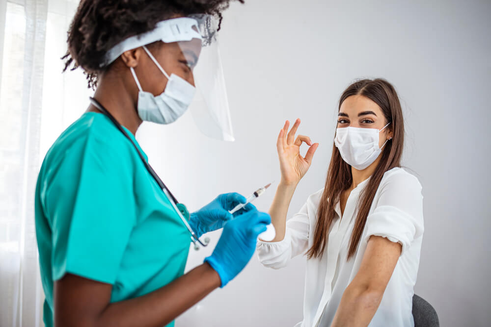 Happy Vaccinated Teen Girl Gesturing Thumbs