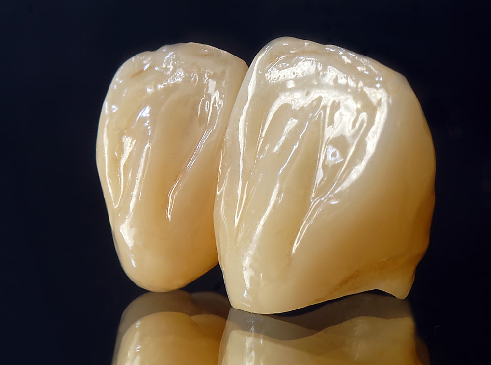 ceramic dental crowns on black background