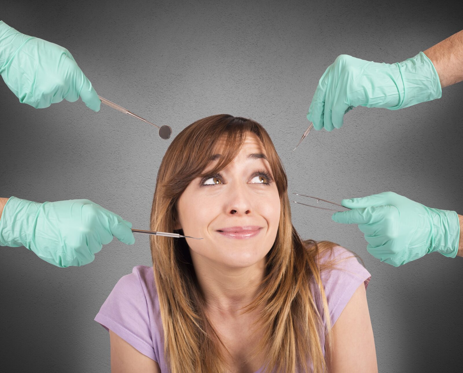 woman with anxiety surrounded by dental tools