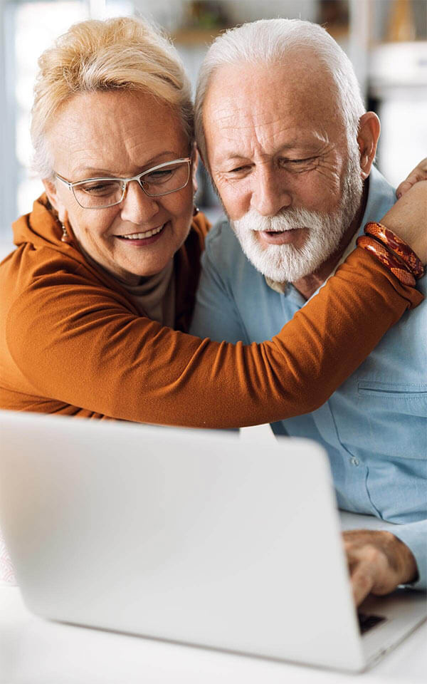 Old couple using laptop