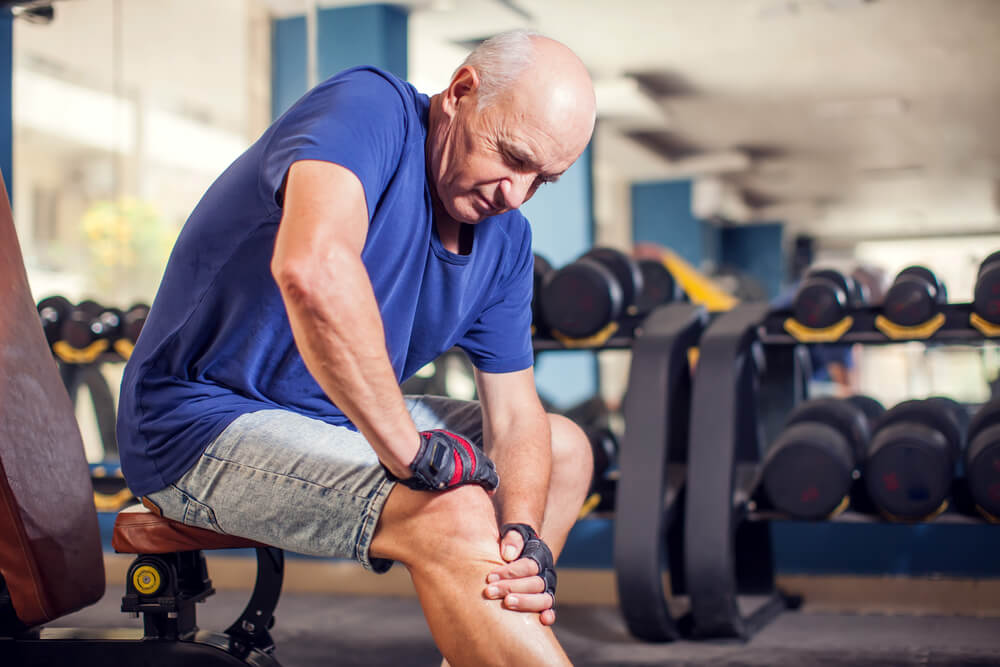 senior man feeling strong knee pain