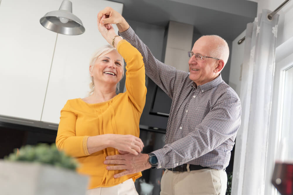 Senior couple dancing and smiling
