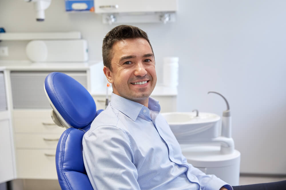 hispanic dental patient waiting in dental chair