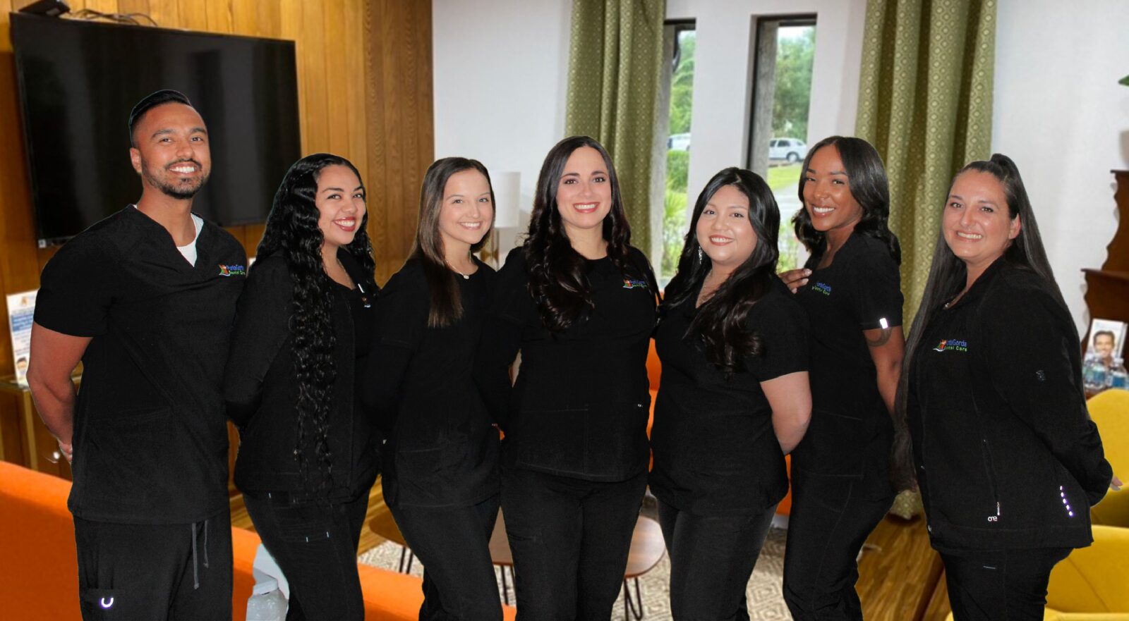 The team at Punta Gorda Dental Care smiling into the camera.