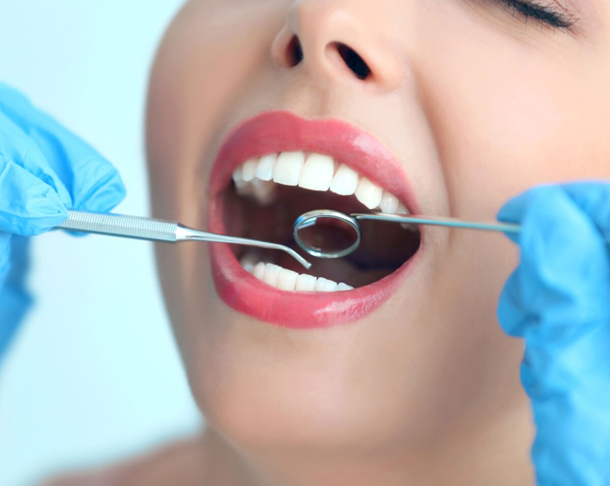 Woman with beautiful smile getting dental exam