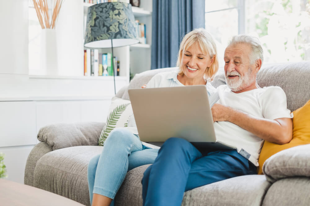 Couple senior using laptop