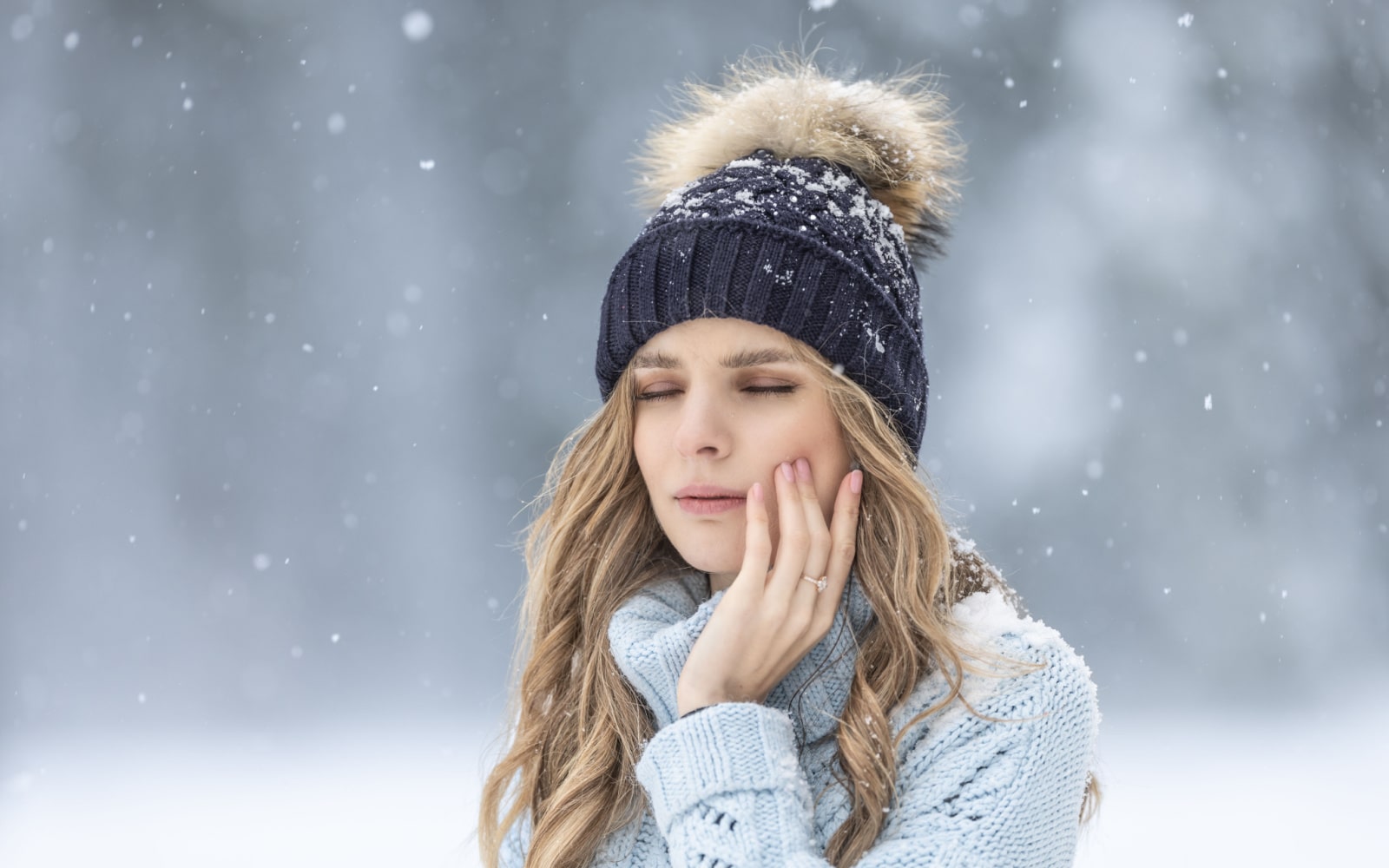 Woman Experiencing Sensitive Teeth During Winter