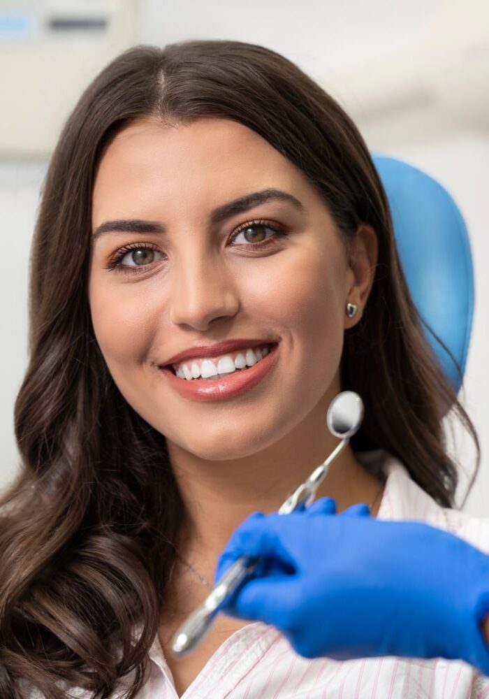 Young woman with gorgeous smile at dentist