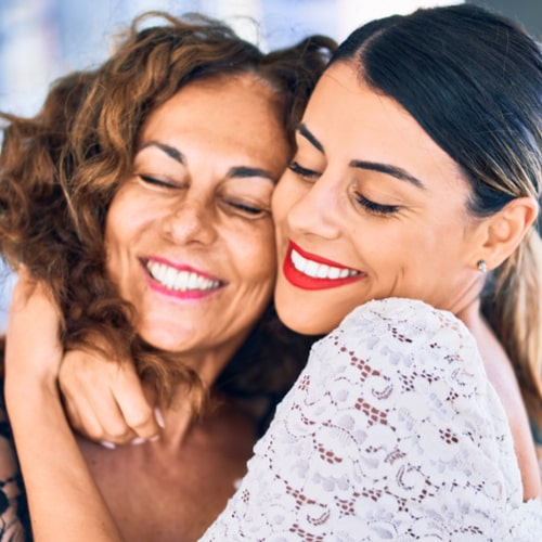 Beautiful mother and daughter smiling happy