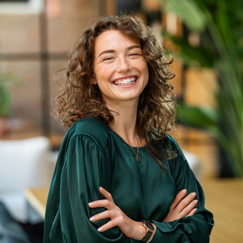 young smiling woman with crossed arms