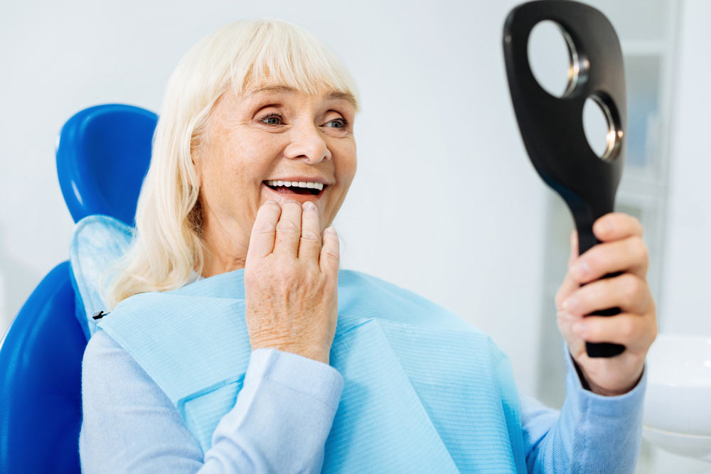 senior women checking her teeth