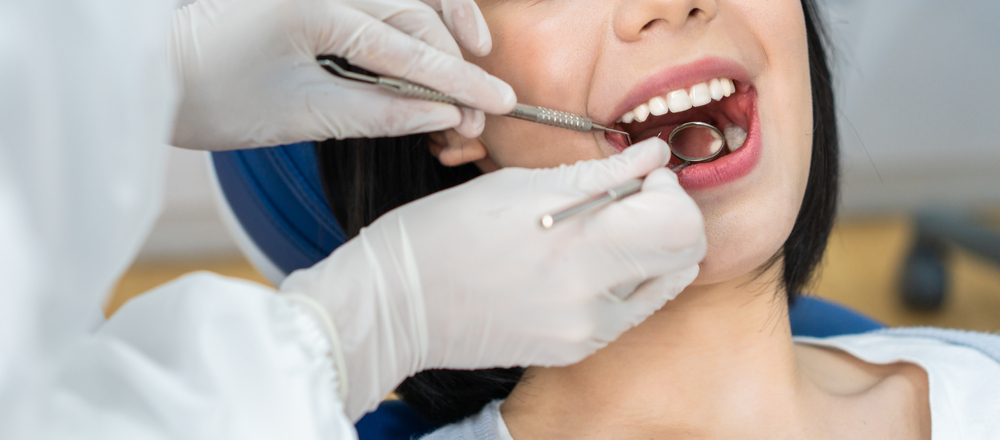 A woman getting her gums check for Periodontal Treatment