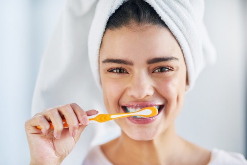 Oral hygiene comes first. Portrait of a beautiful young woman brushing her teeth in the bathroom at home