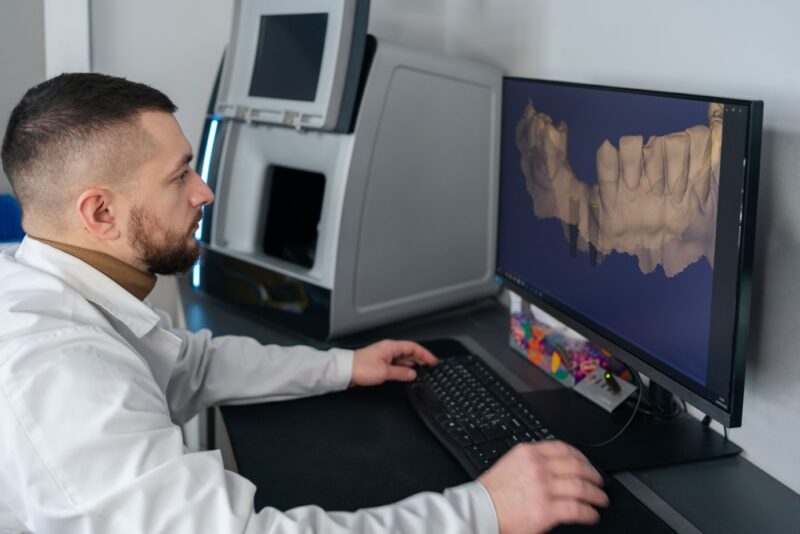 Digital dentistry. Man working with digital scan in modern dentistry