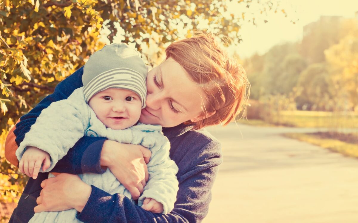 Woman With Child In Autumn