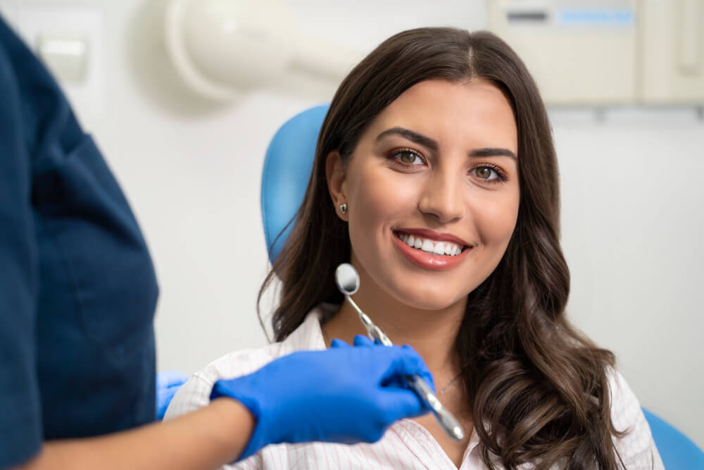 Young woman with gorgeous smile at dentist