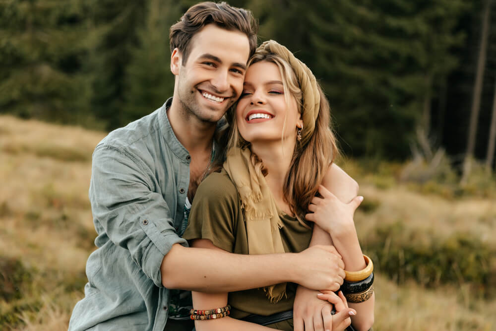Loving young couple hugging and smiling together