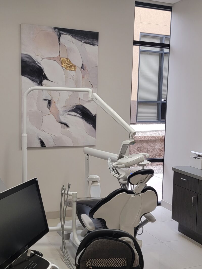 Treatment room with painting on wall - Carefree Smile Design