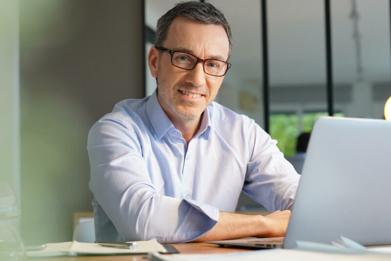 man working in office on laptop