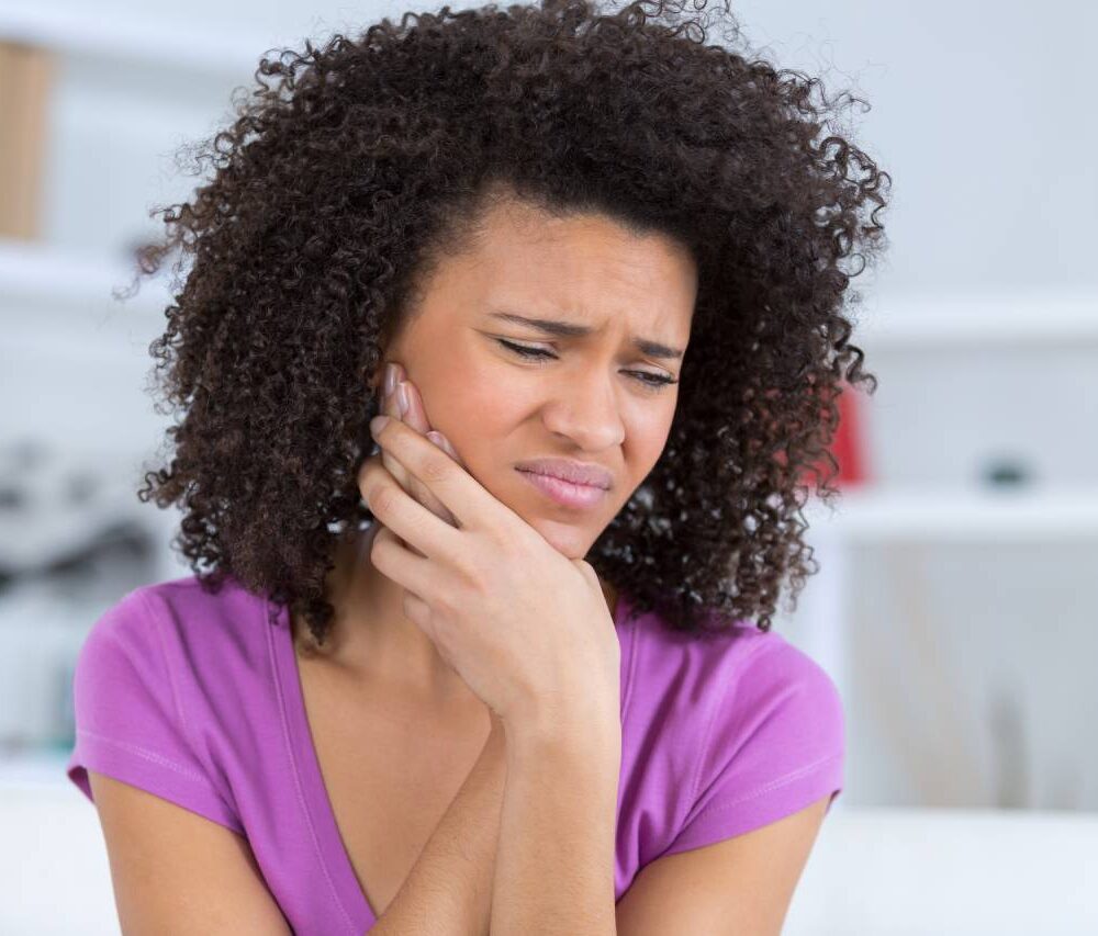 young woman have a toothache