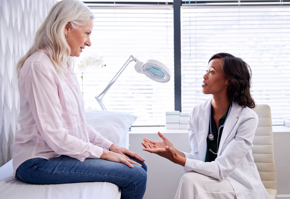 Mature Woman In Consultation With Female Doctor