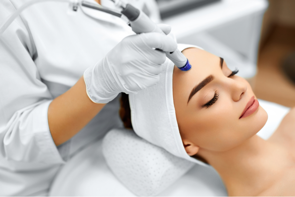 Woman Getting Facial Hydro Microdermabrasion Peeling Treatment