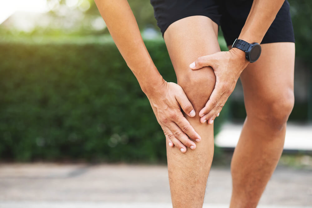 Man suffering from Knee pain after exercise
