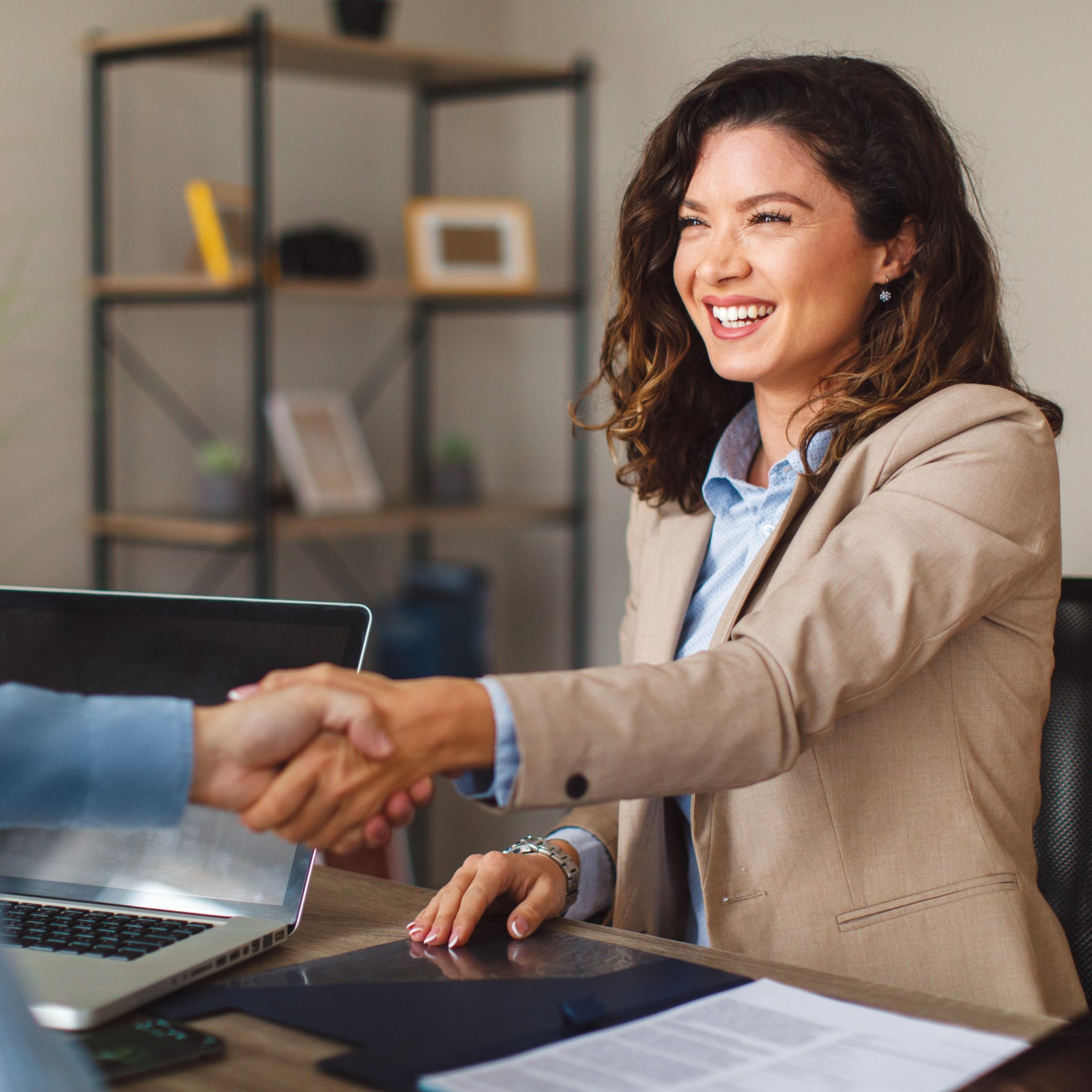 Young woman handshake with a man