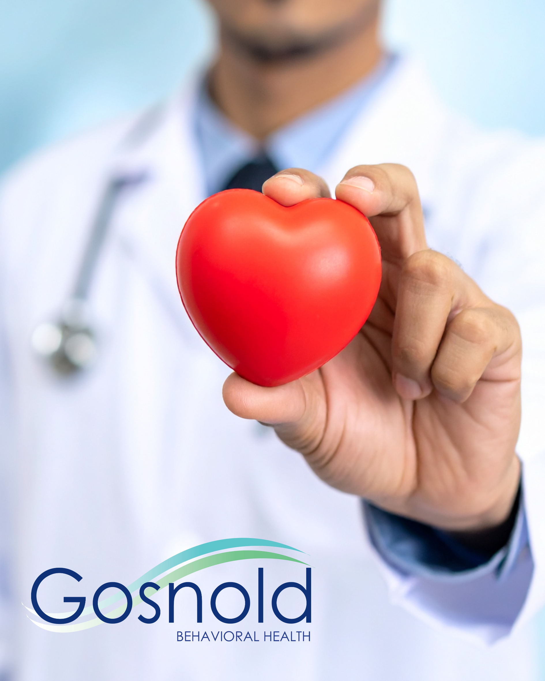 Doctor holding a red heart