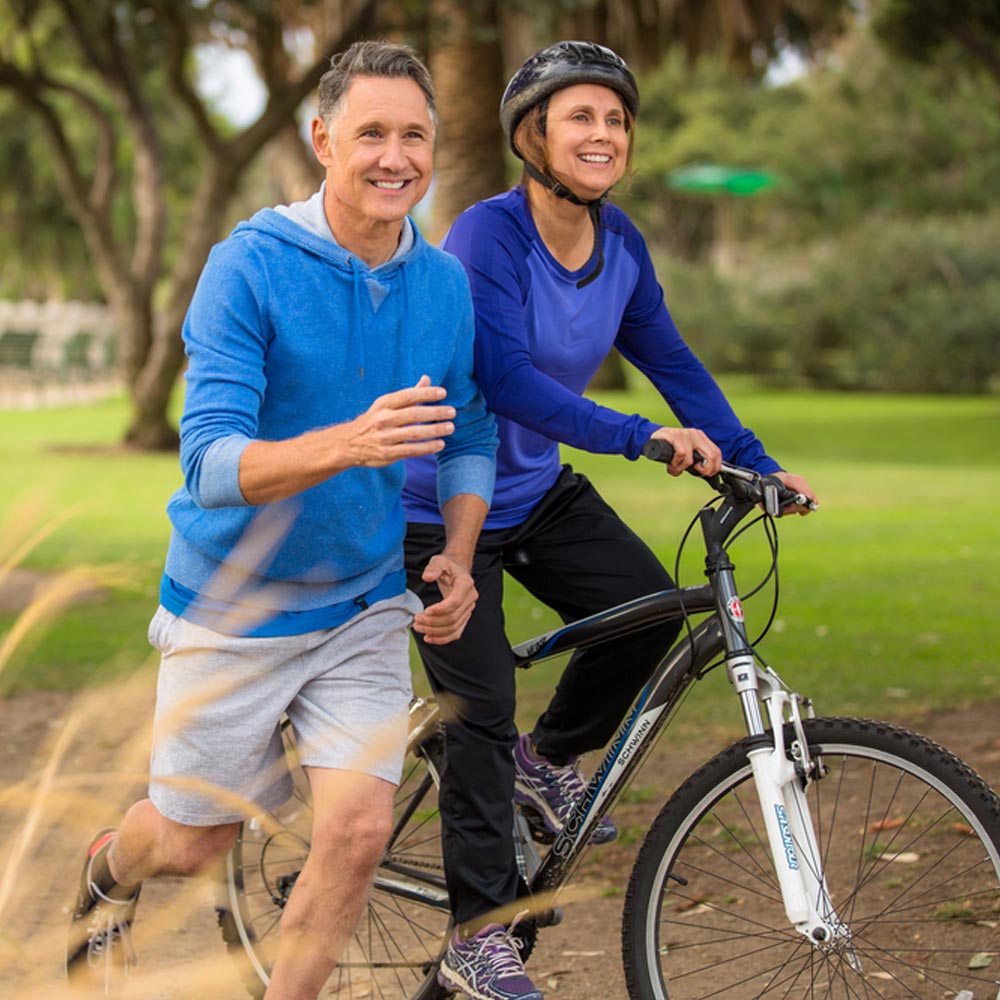 Elder couple exercising in the park