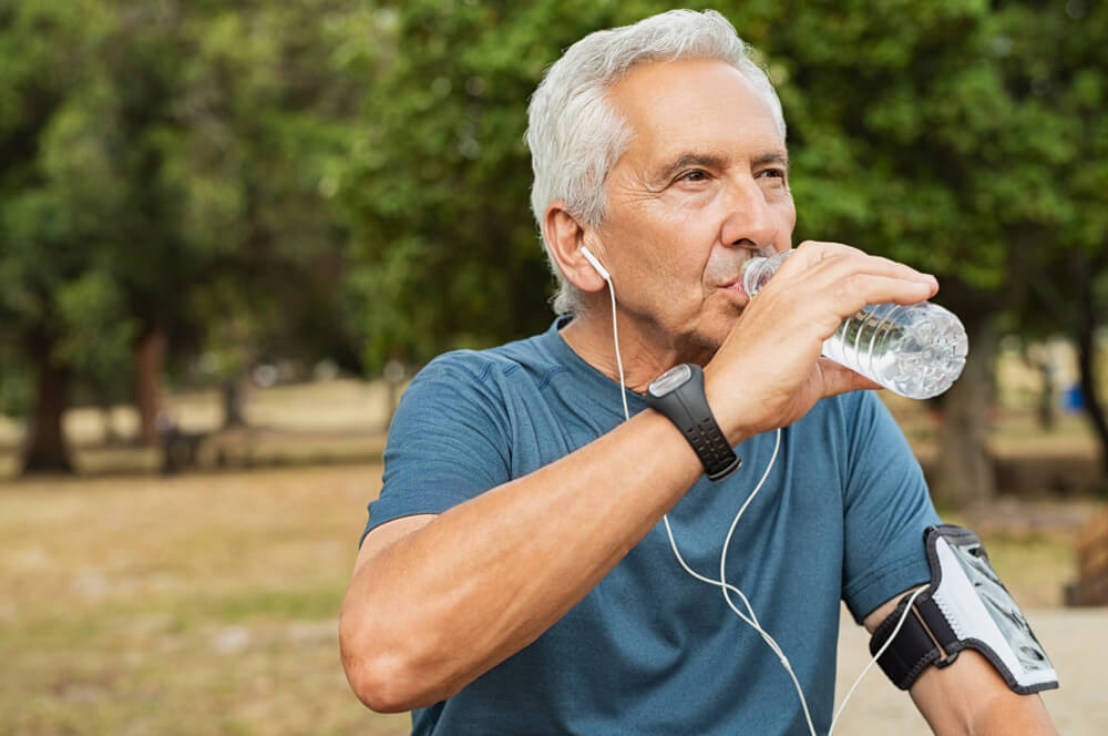 senior man drinking water