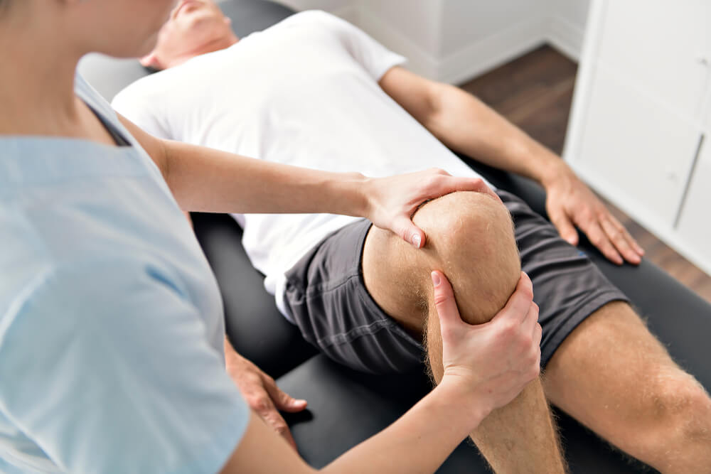 Patient at the physiotherapy doing physical exercises