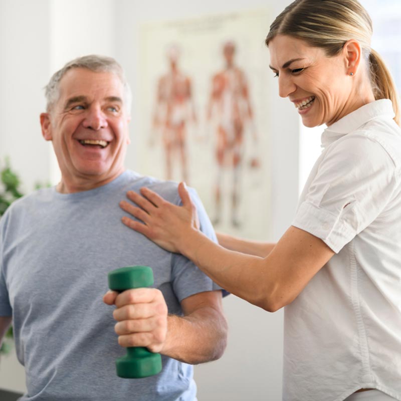 rehabilitation physiotherapy worker with senior client