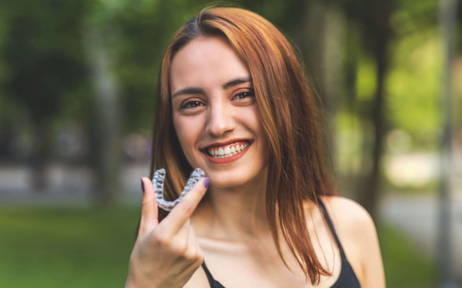 Woman Smiling with Invisalign