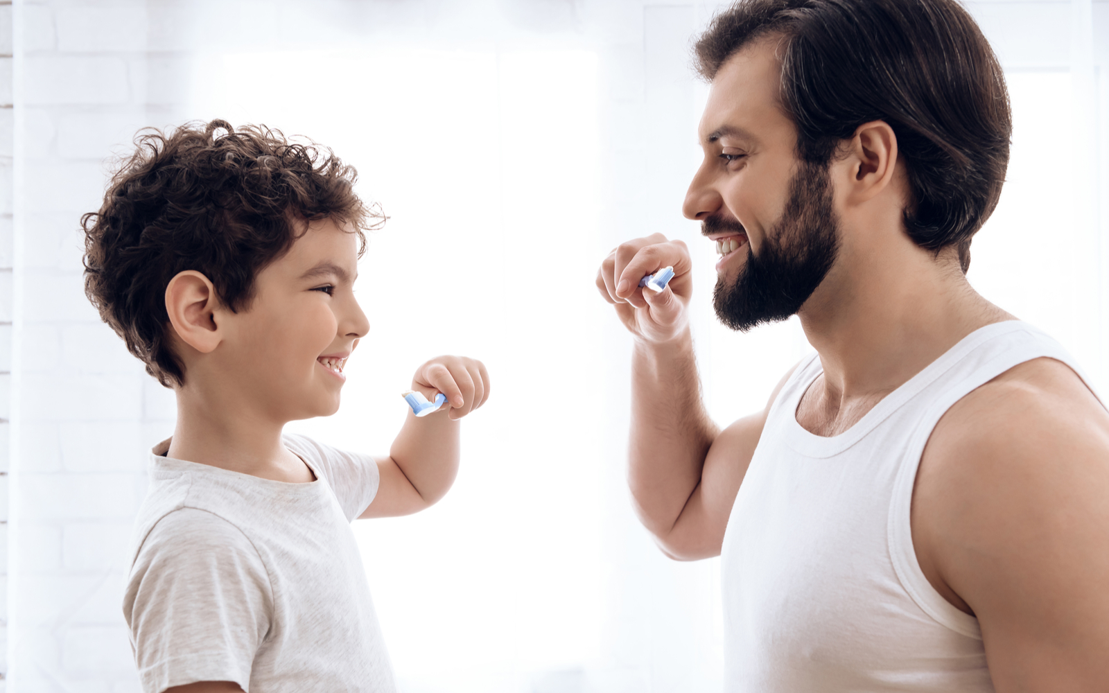 Father and Son Brushing Their Teeth