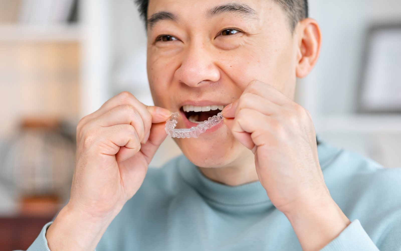 Man Caring For His Invisalign Aligners