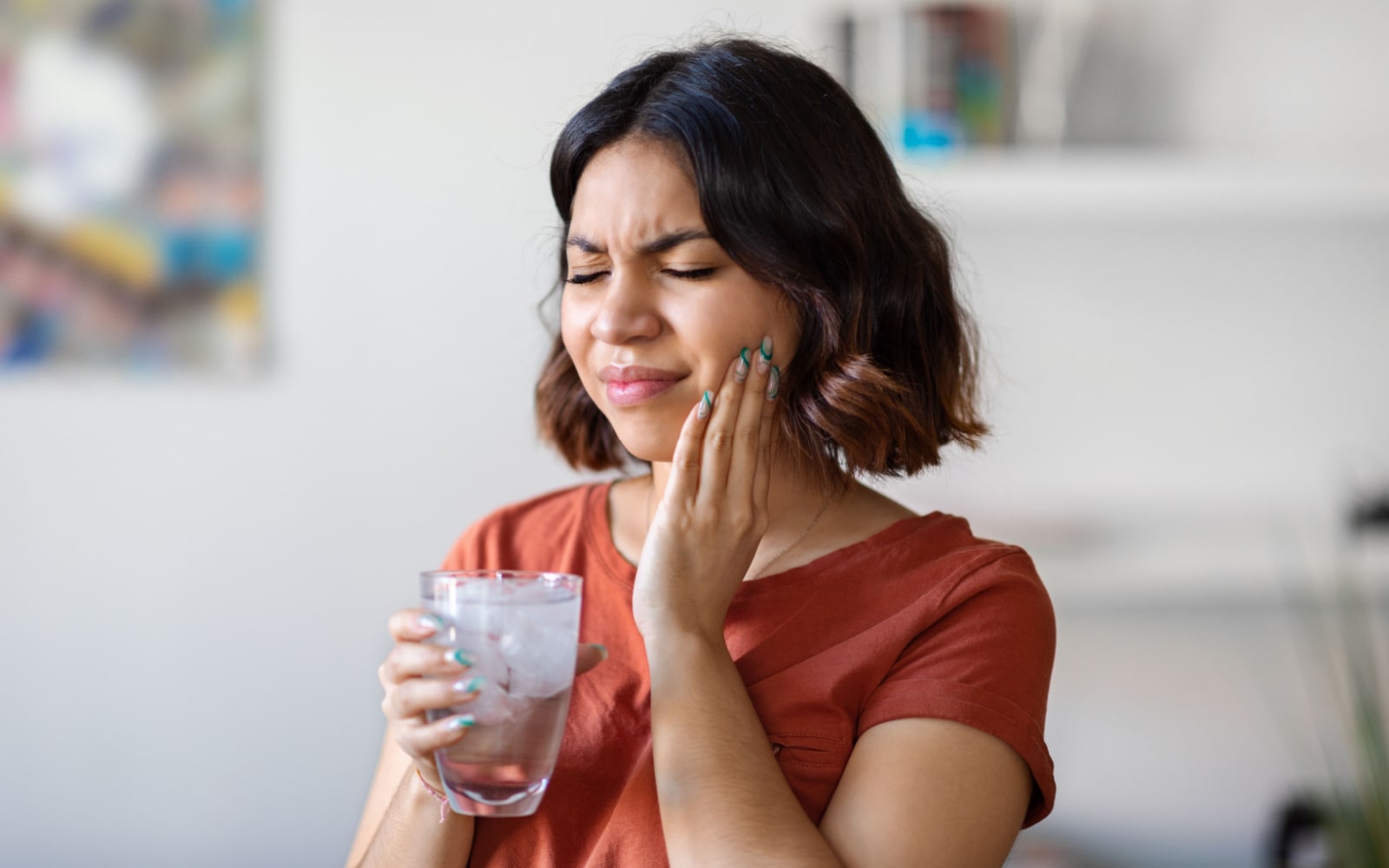 Woman Facing Sensitive Teeth From Cold Water