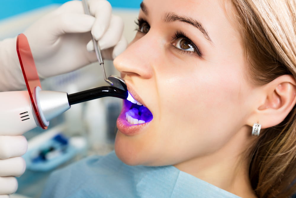 Doctor examines the oral cavity on tooth decay. Caries protection.