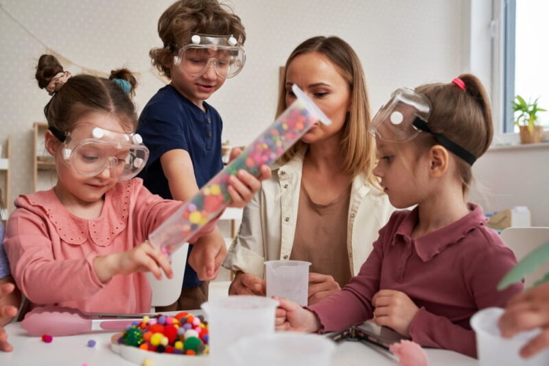 Children in lab glasses having sensory exercises