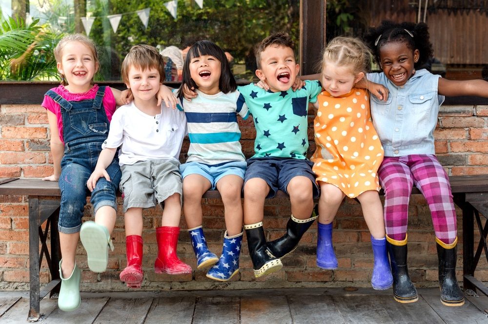 group of children smiling together