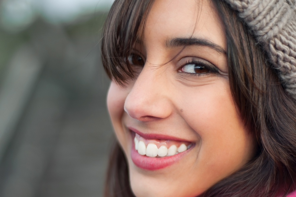 Happy and smiling young woman's portrait