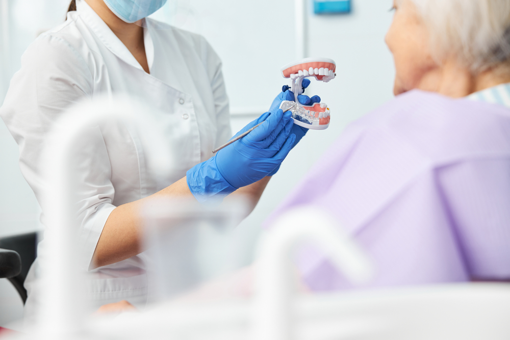 A dental professional speaking with a patient about the importance of Prevention in dental health