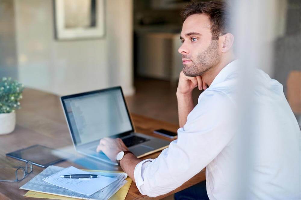 Young businessman thinking about work