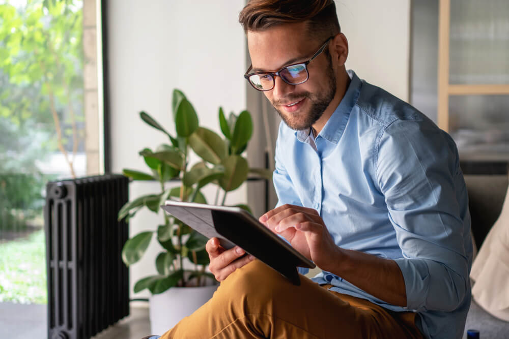 Young Man holding digital tablet