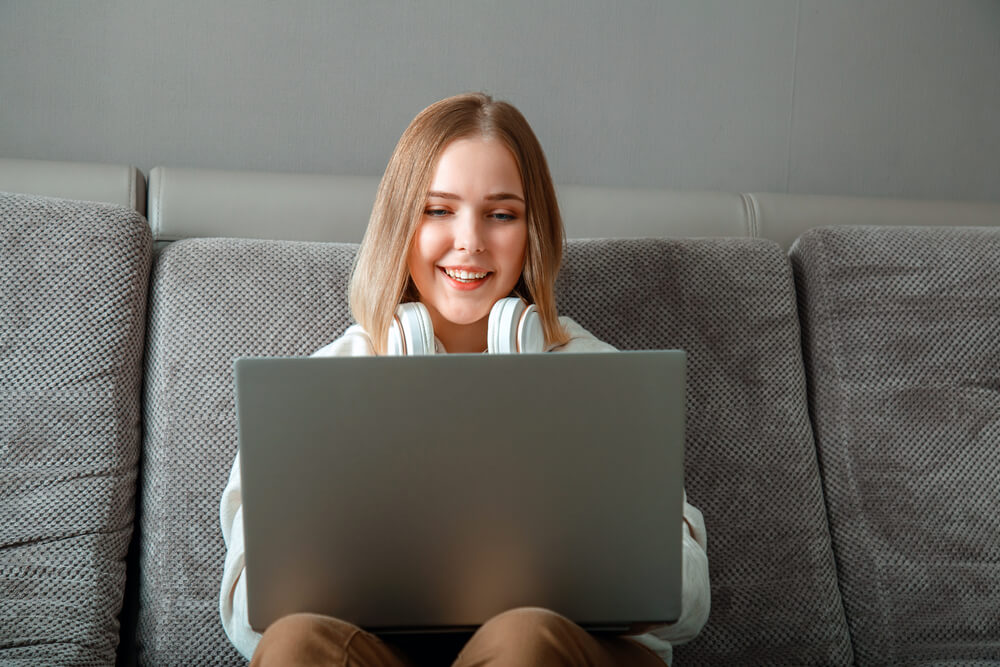 Beautiful young woman working on laptop